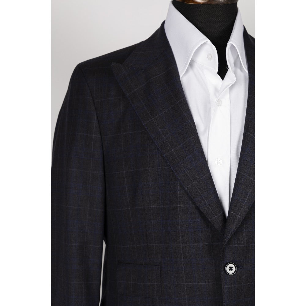 Shoulder and notch lapel detail of the navy windowpane check wool jacket, worn over a white dress shirt.